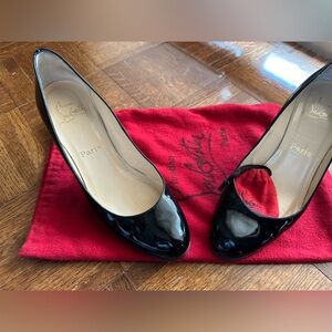 Women’s patent leather black Louboutin heels